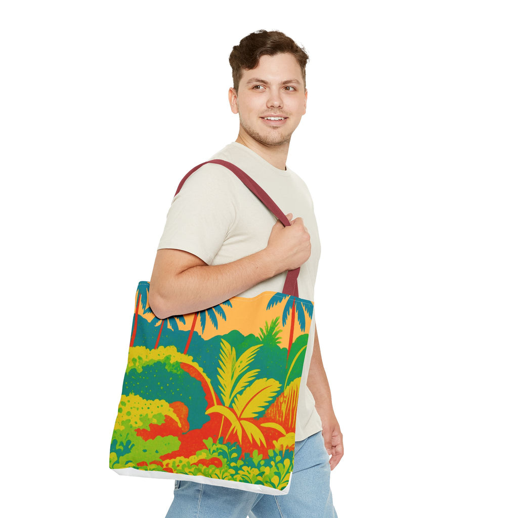 Man holding a colorful tote bag with a tropical design inspired by St Joseph in Barbados on a white background