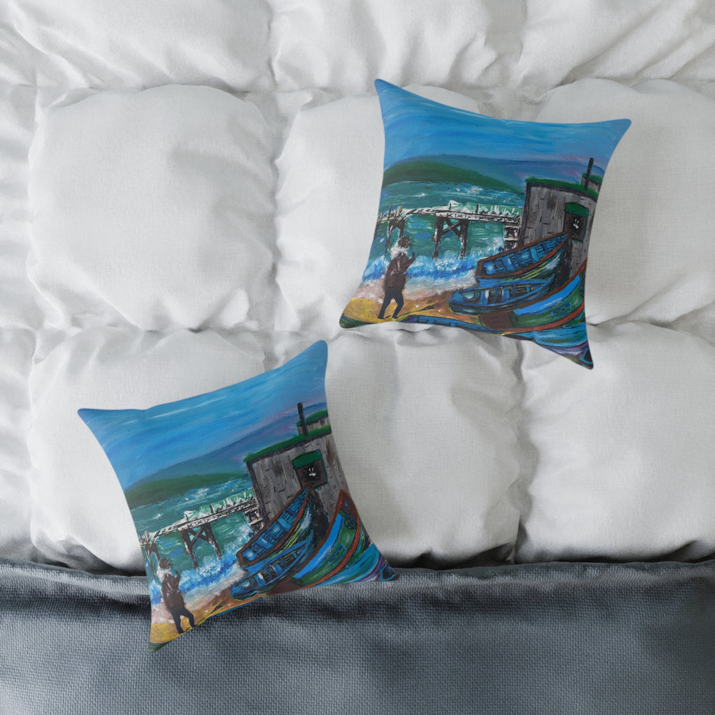 two cushions showing isle of wight coastal scene on a bed