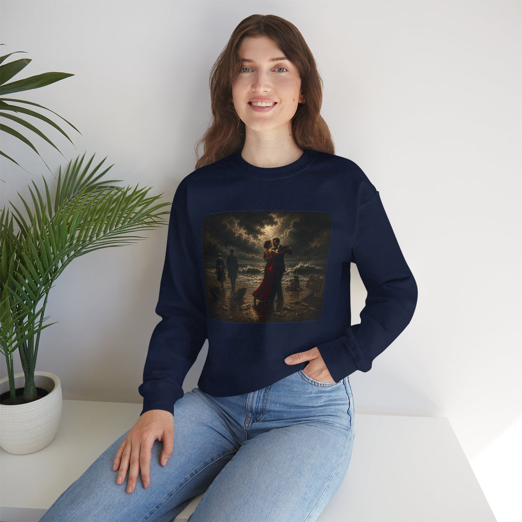 Woman wearing a navy blue sweatshirt with a Vettriano inspired singing butler printed graphic sitting on a white surface with a plant in the background.
