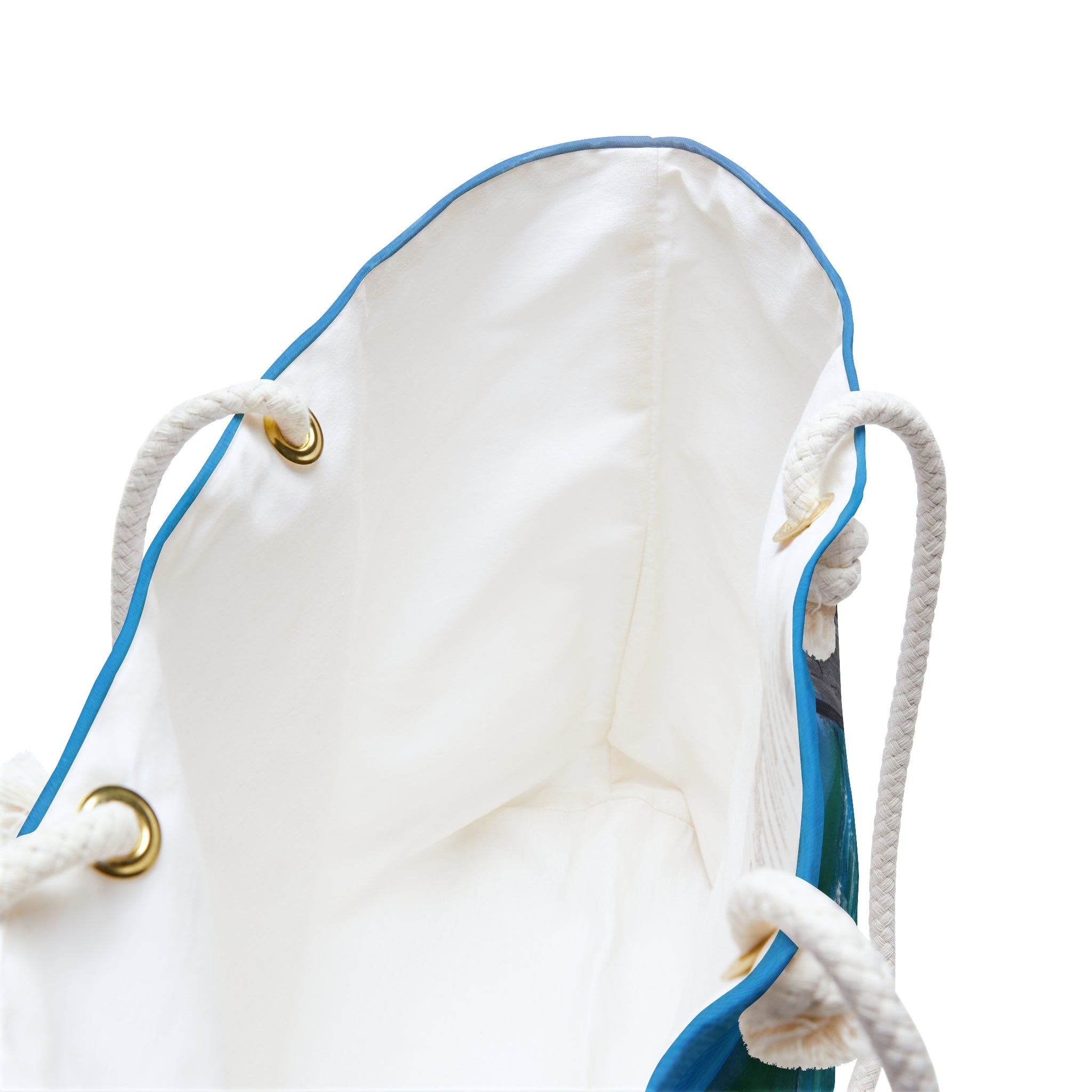 the white inside of a colourful beach bag also showing the cream rope handles