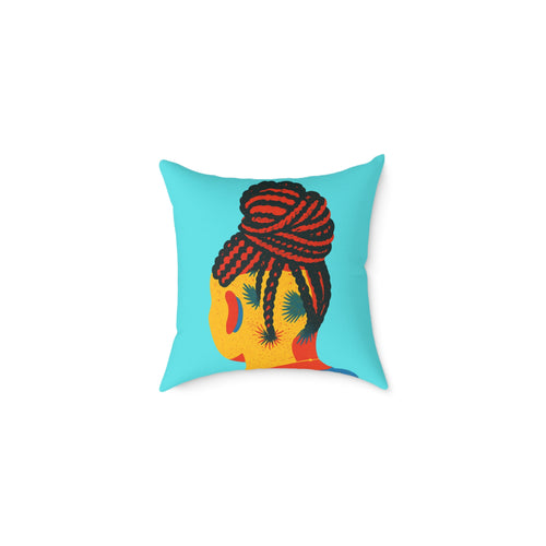 Decorative pillow with a colorful design of a face and braided hair on a blue background