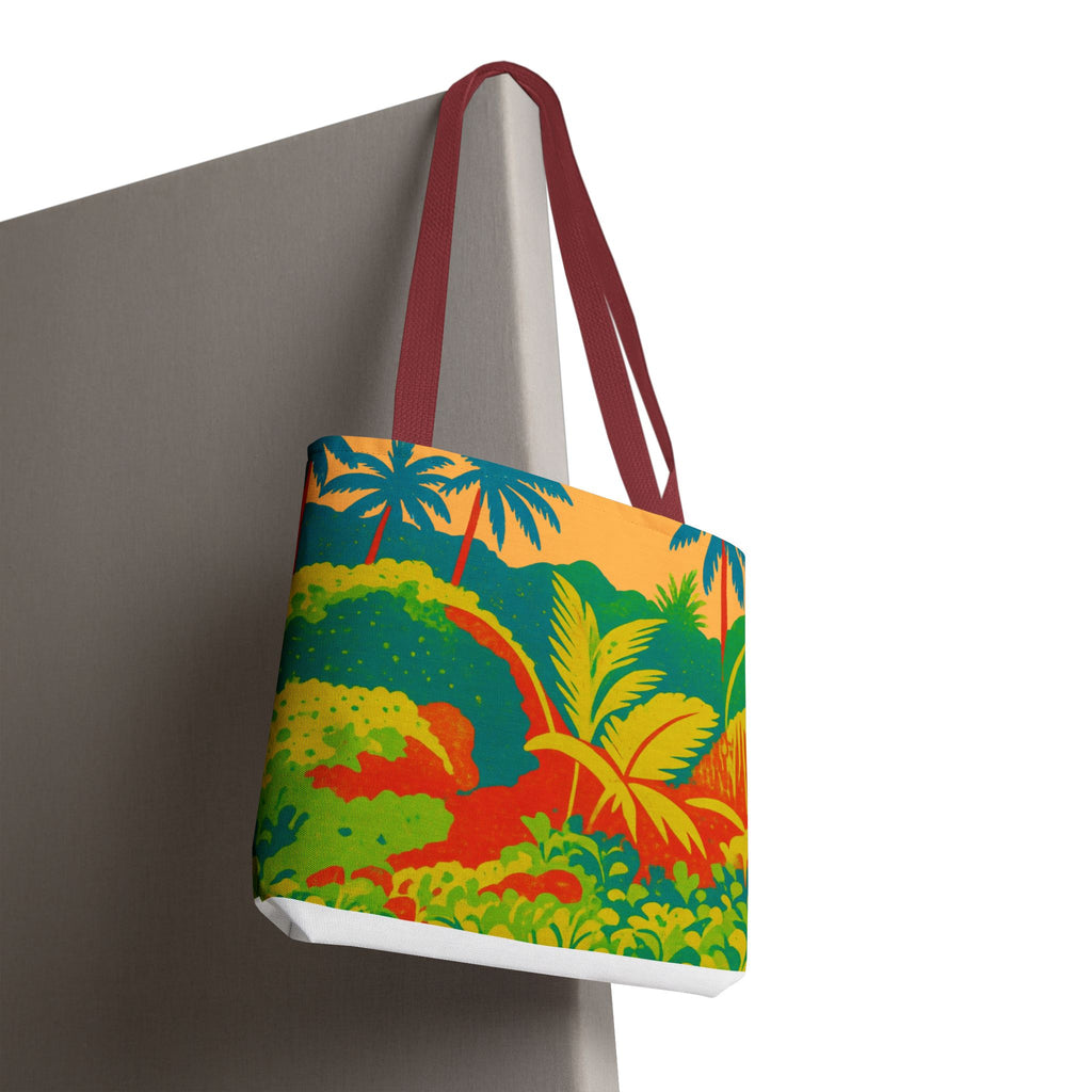 Tote bag with a colorful tropical design inspired by St Joseph in Barbados hanging on a Grey surface.