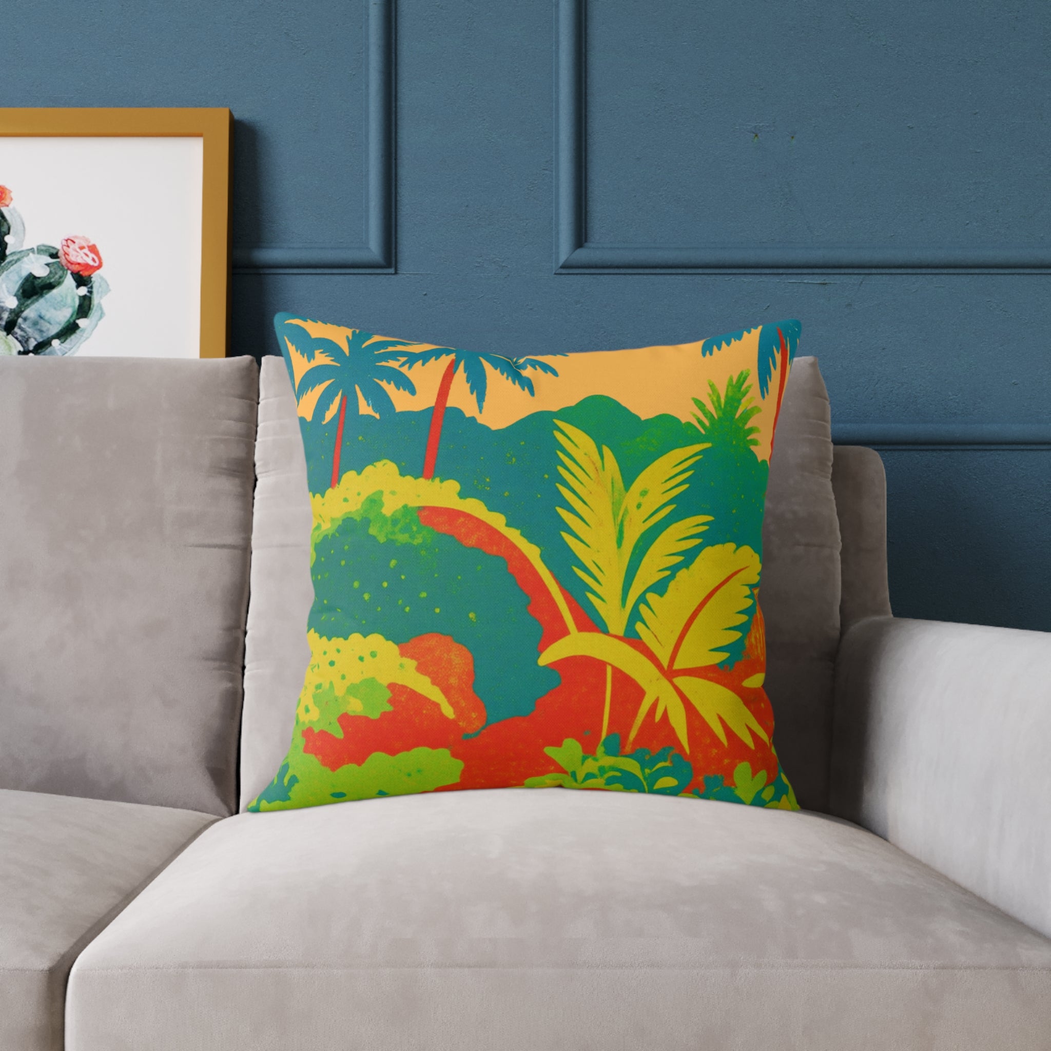 Tropical risograph type print cushion on a grey sofa with blue background.