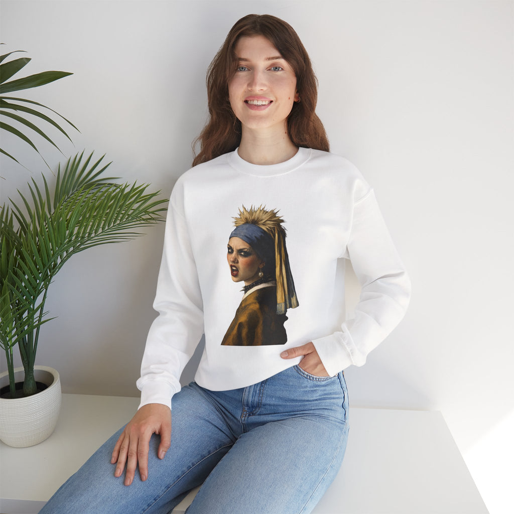 Person wearing a white sweatshirt with a graphic design of a punk version of the girl with a pearl earring sitting in a room with a plant.