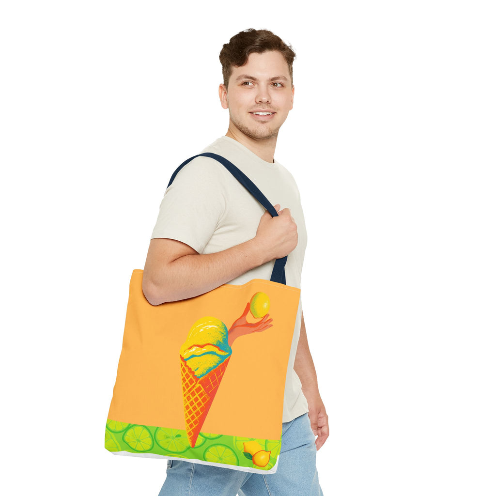 Man holding a tote bag with a colorful ice cream cone design on a white background