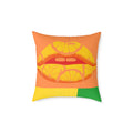 Decorative pillow with a design of lips made from lemon slices on an orange background