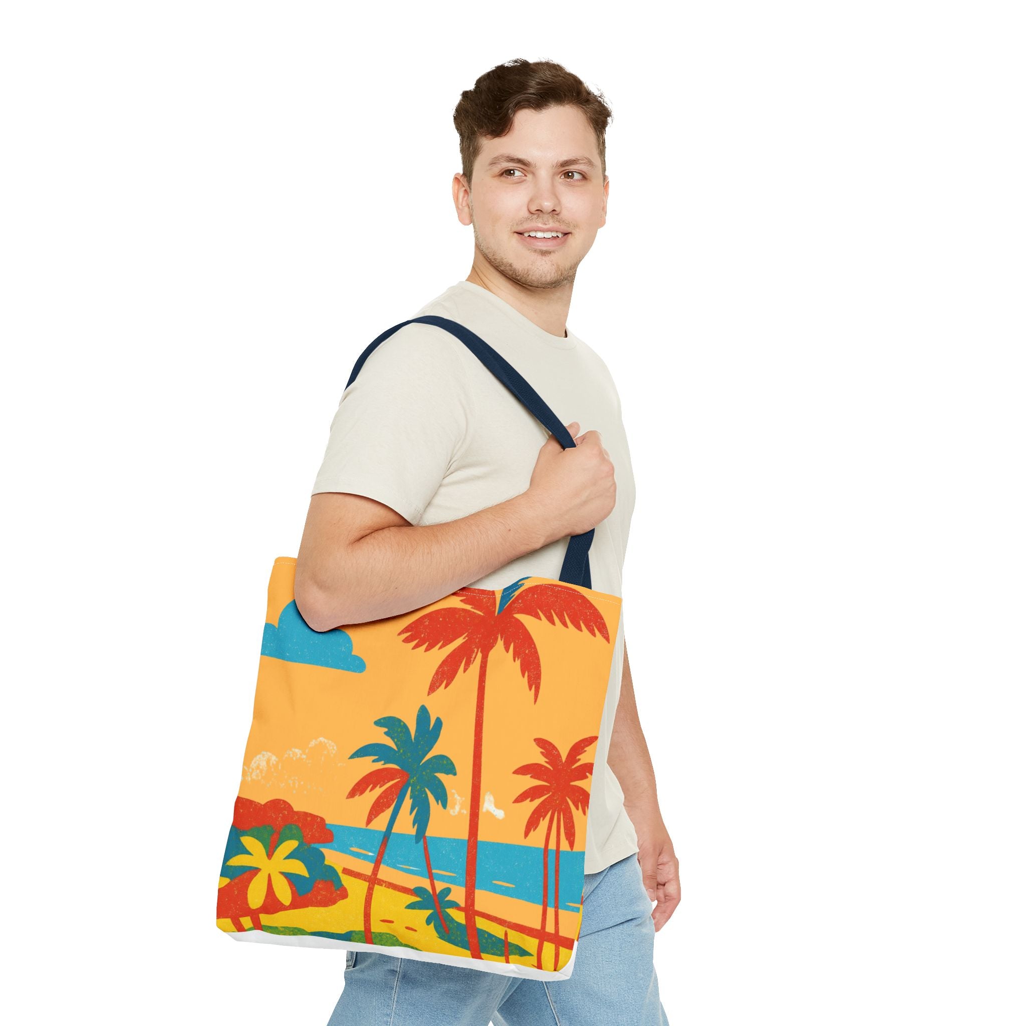 Man in white tshirt and jeans holding a colourful tote bag with a beach sign inspired by St Philip in Barbados on a white background