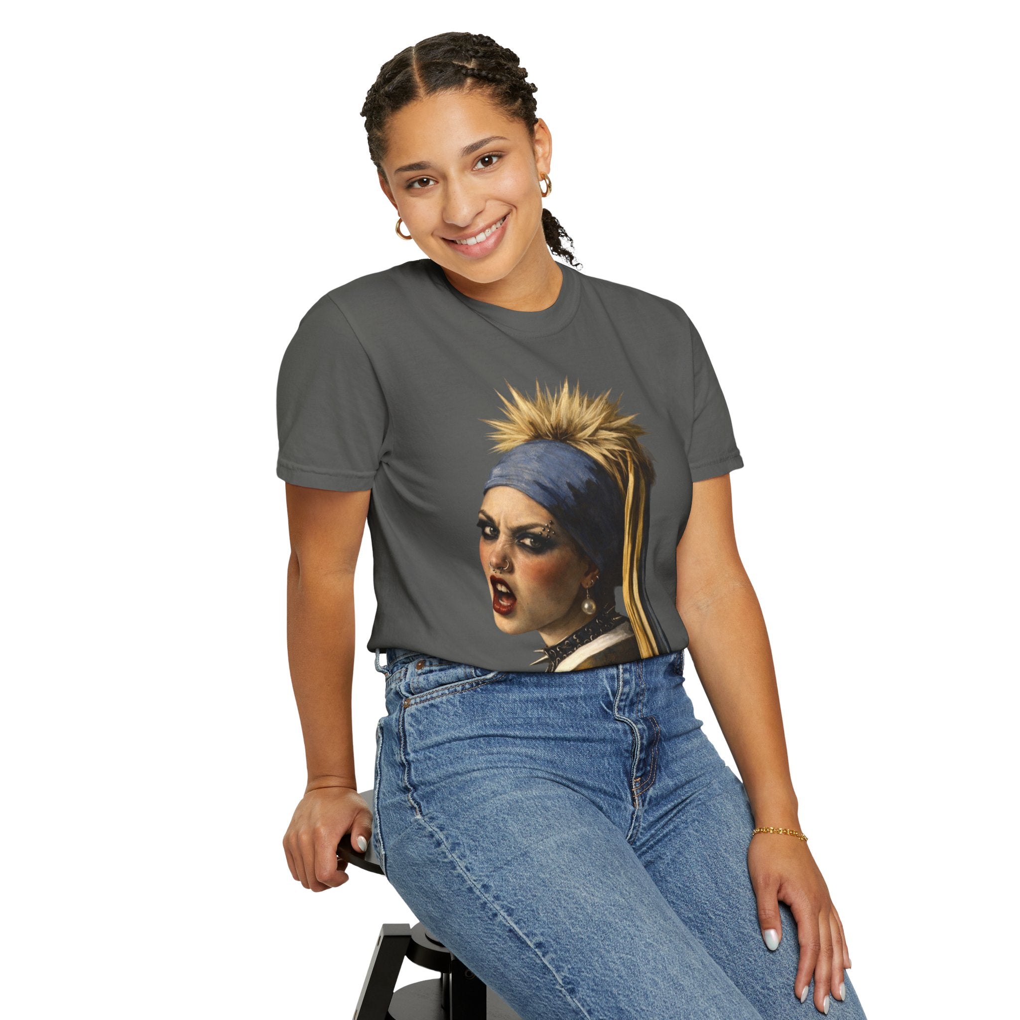 Person wearing a grey t-shirt with a reimagined image of Vermeer's girl with a pearl earring sitting on a stool against a white background