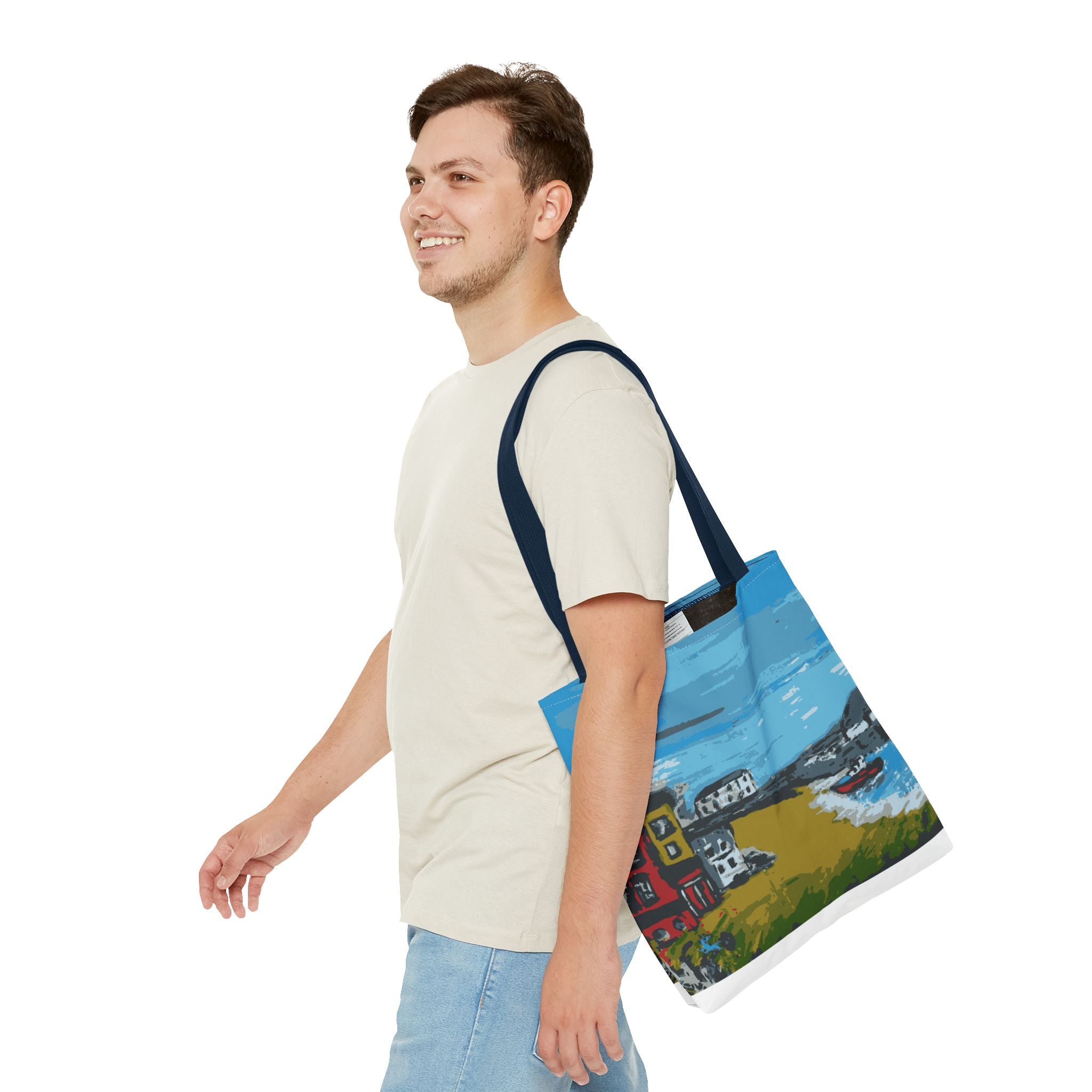 Man carrying a tote bag with a scene of Viking Bay in Broadstairs, Kent on a white background
