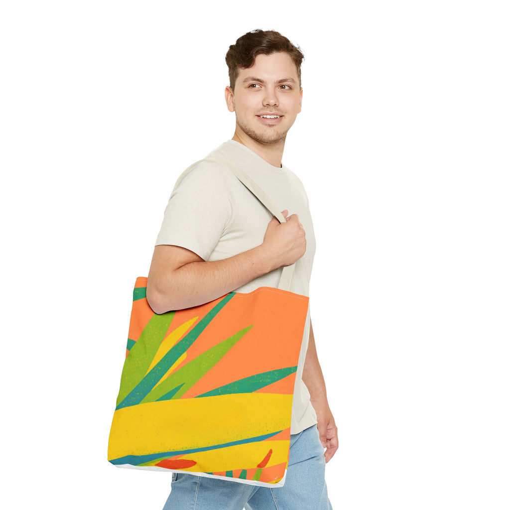 Man holding a colorful tote bag with a tropical design inspired by Ragged Point, St Philip, Barbados  white background