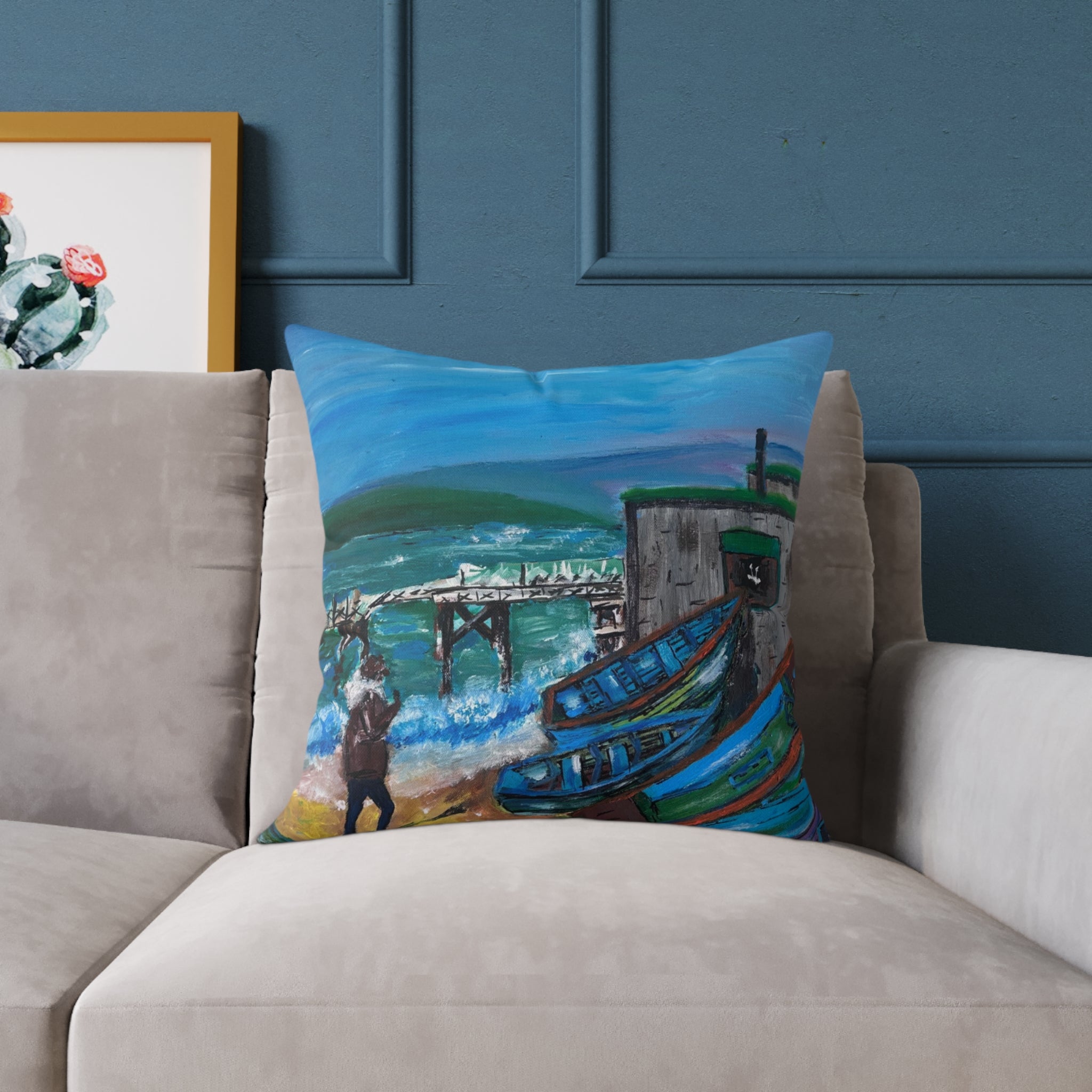 isle of wight coastal cushion on a beige sofa on a blue background