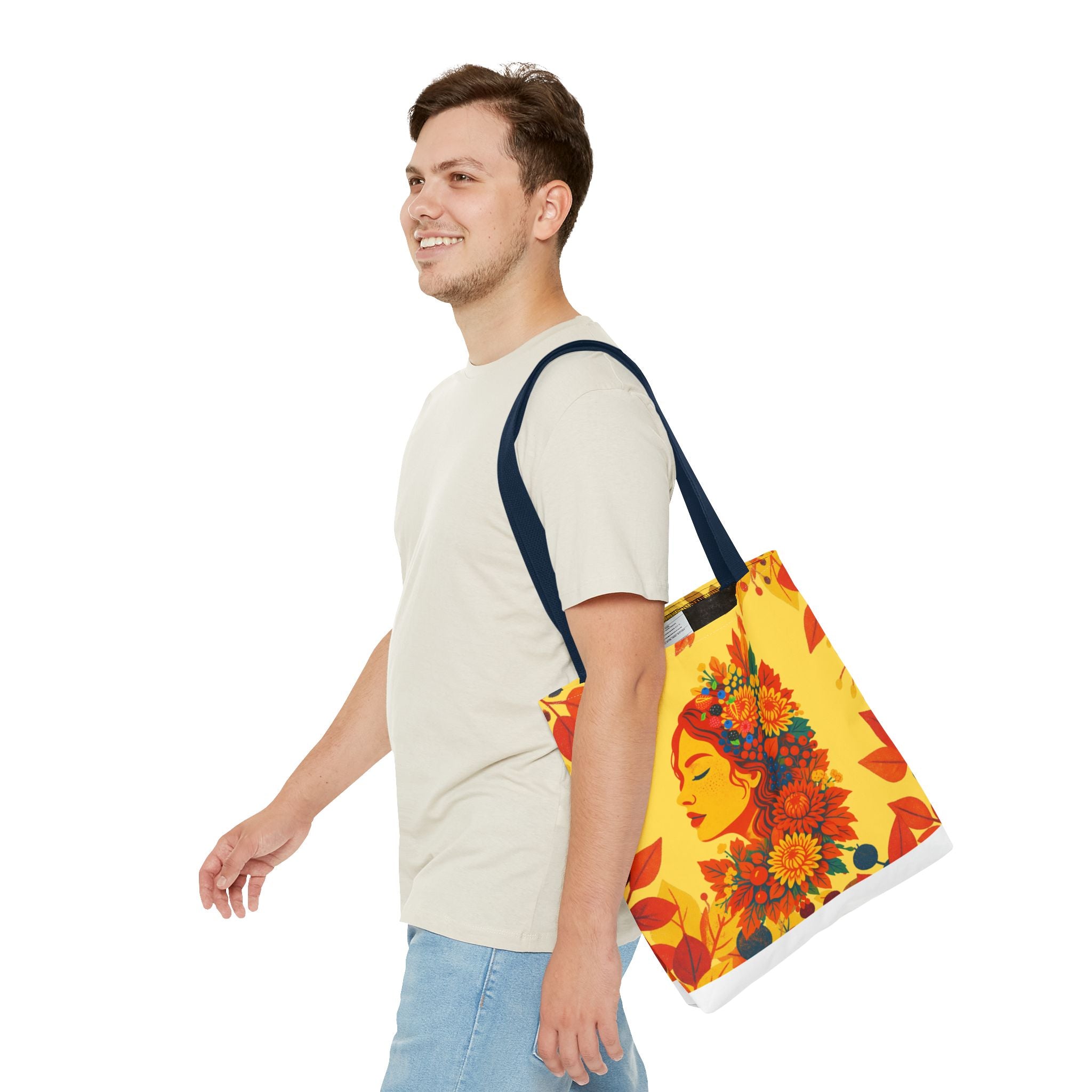 Man carrying a colorful tote bag with a floral design on a white background