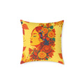Decorative pillow with a colorful design of a woman's face and flowers on a yellow background