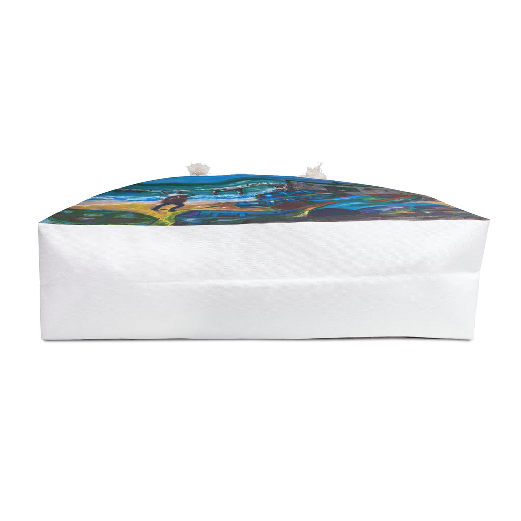 a beach bag showing an isle of wight coastal scene upturned to show the bottom of the bag in white