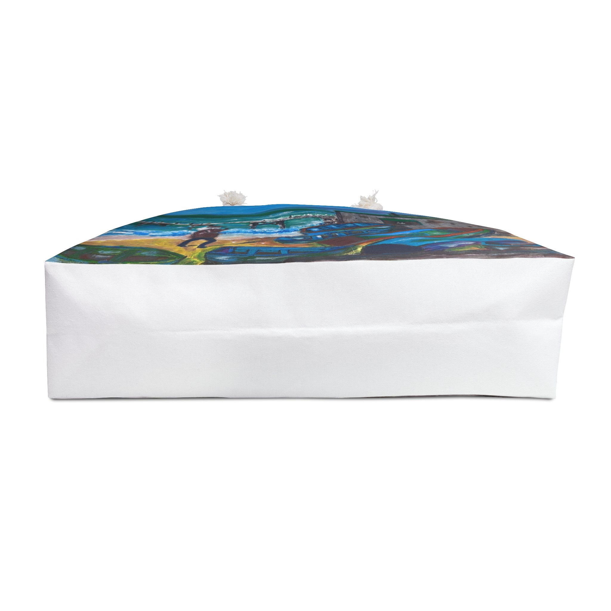 a beach bag showing an isle of wight coastal scene upturned to show the bottom of the bag in white