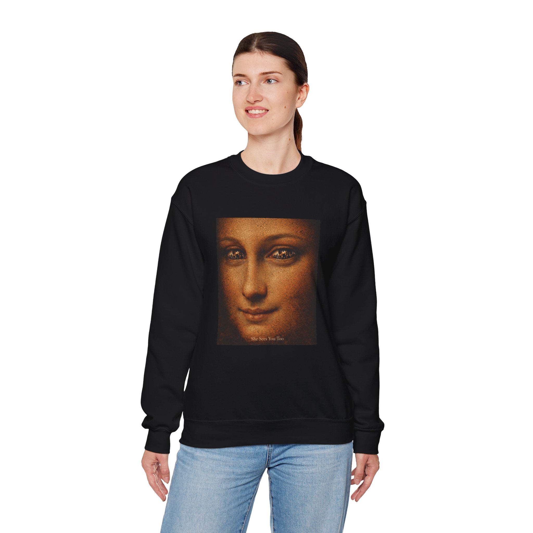 woman wearing a black sweatshirt showing a reimagined image of Da Vinci's Mona Lisa on a white background