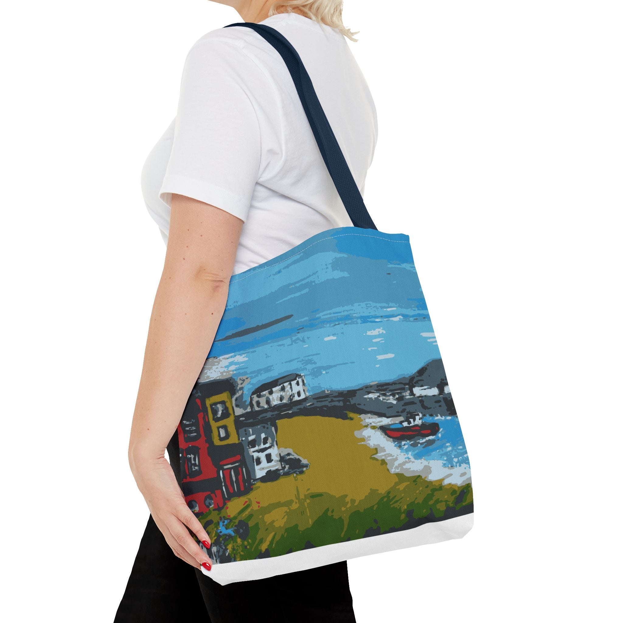 Woman holding a tote bag with a scenic design of Viking Bay, Broadstairs.