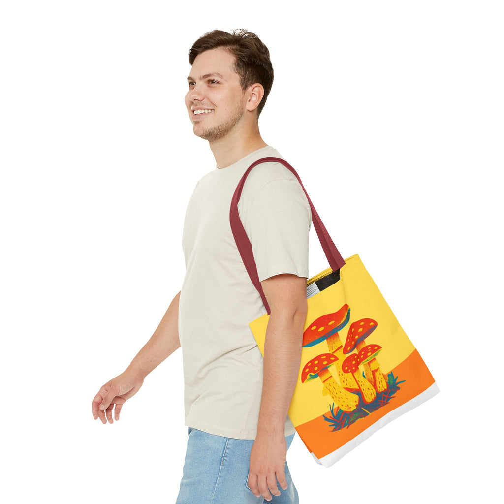 Man carrying a colorful tote bag with mushroom design on a white background