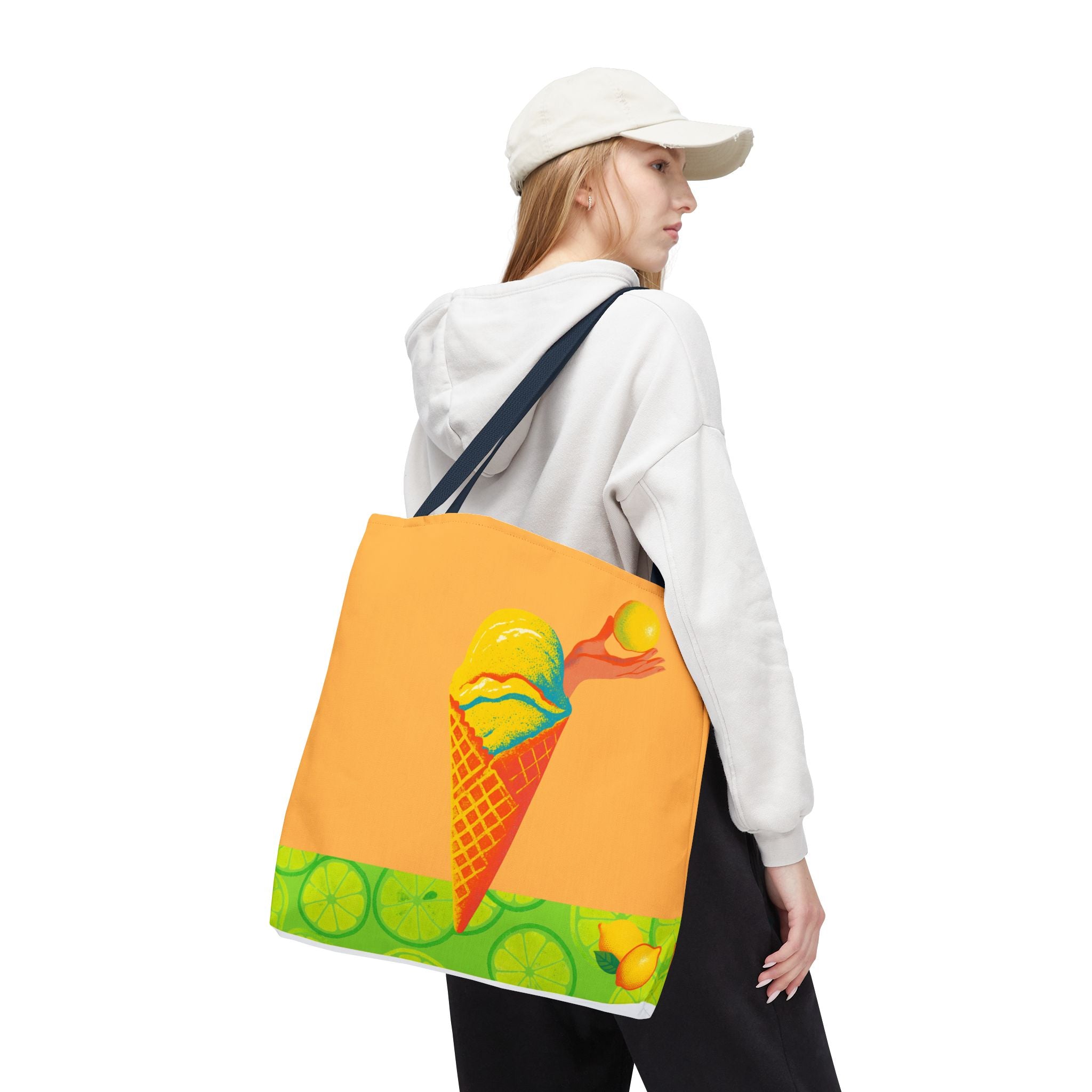 Person wearing a white hoodie and a colorful tote bag with a design on a white background