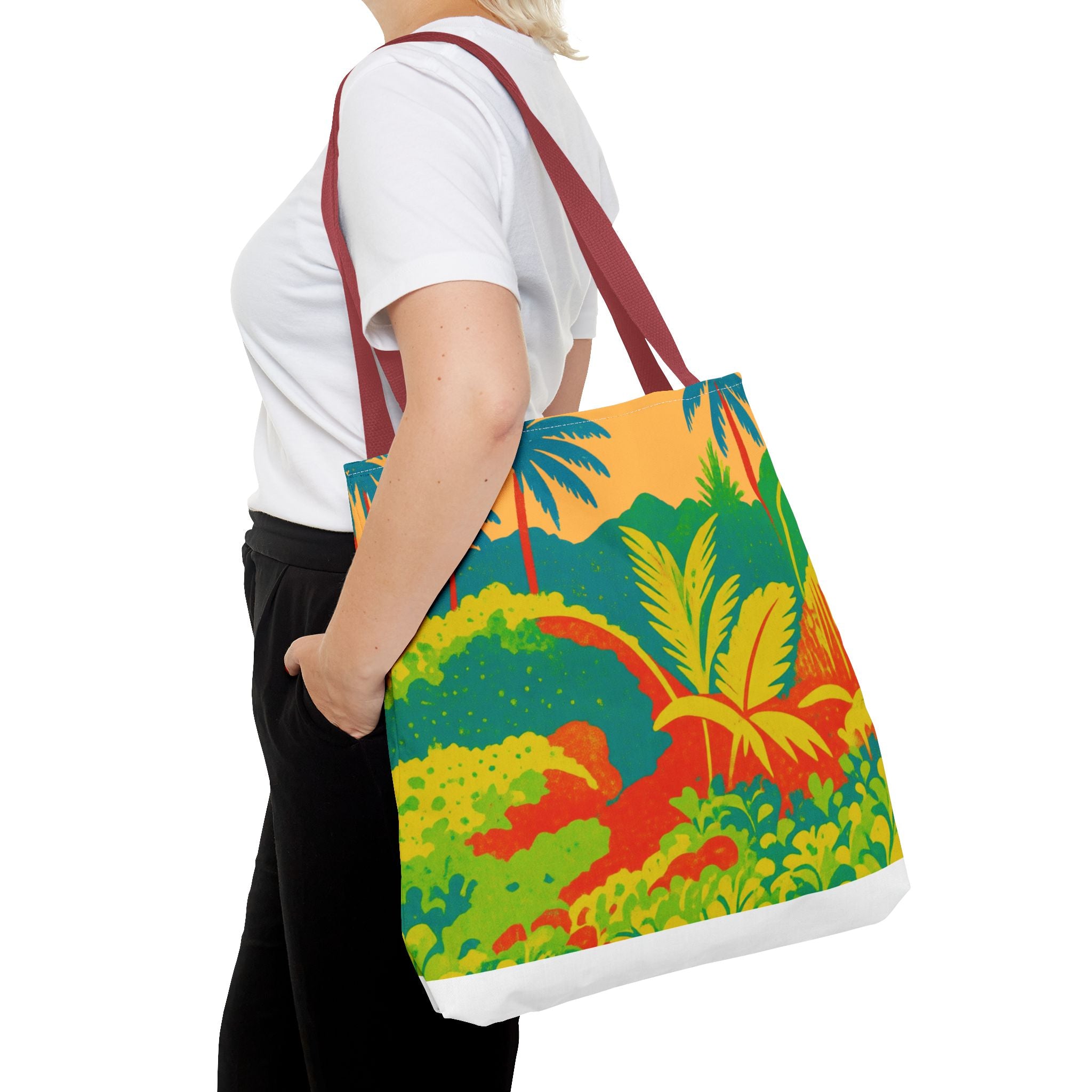 Person holding a colorful tote bag with a tropical design inspired by St Joseph in Barbados on a white background