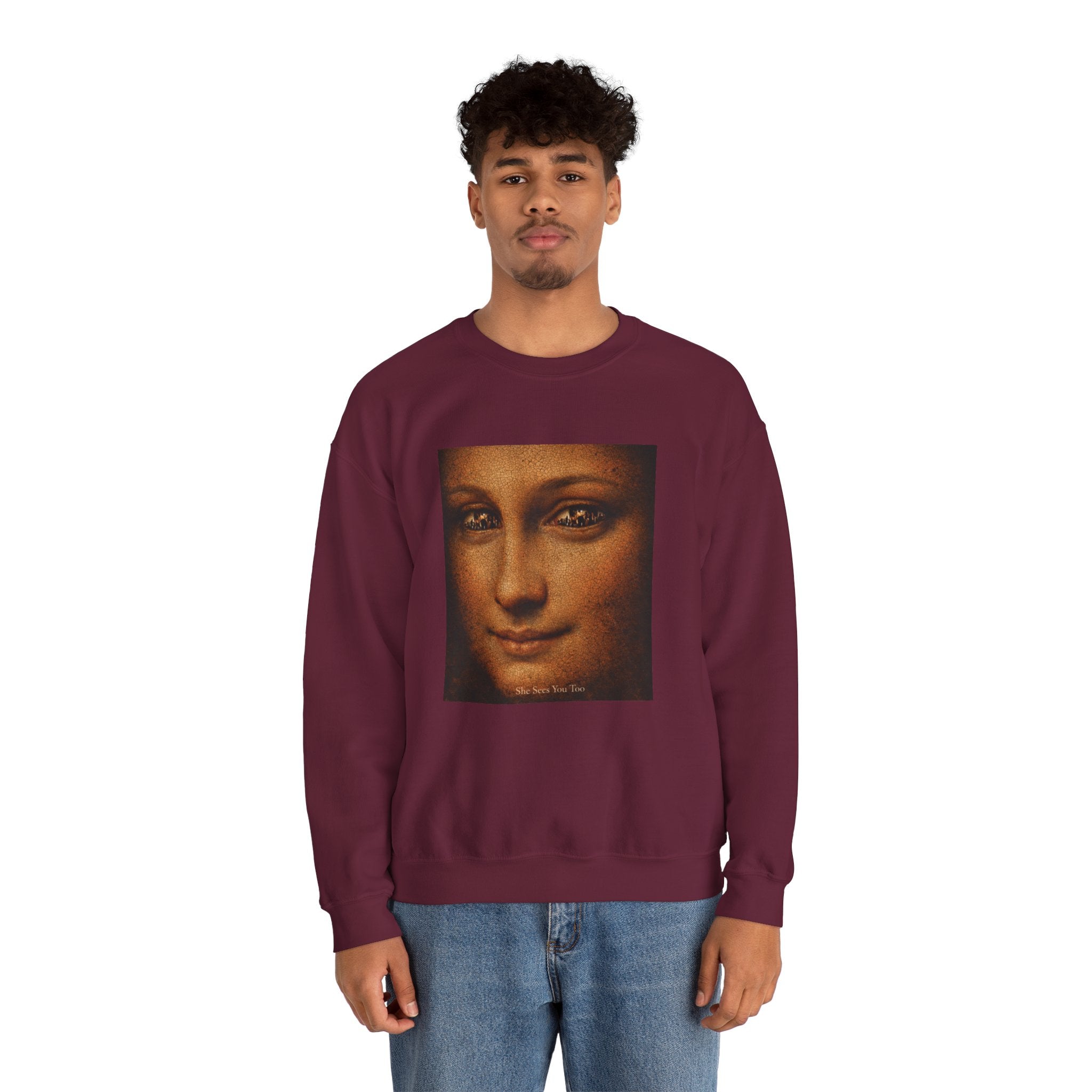 man wearing a maroon sweatshirt showing a reimagined image of Da Vinci's Mona Lisa on a white background