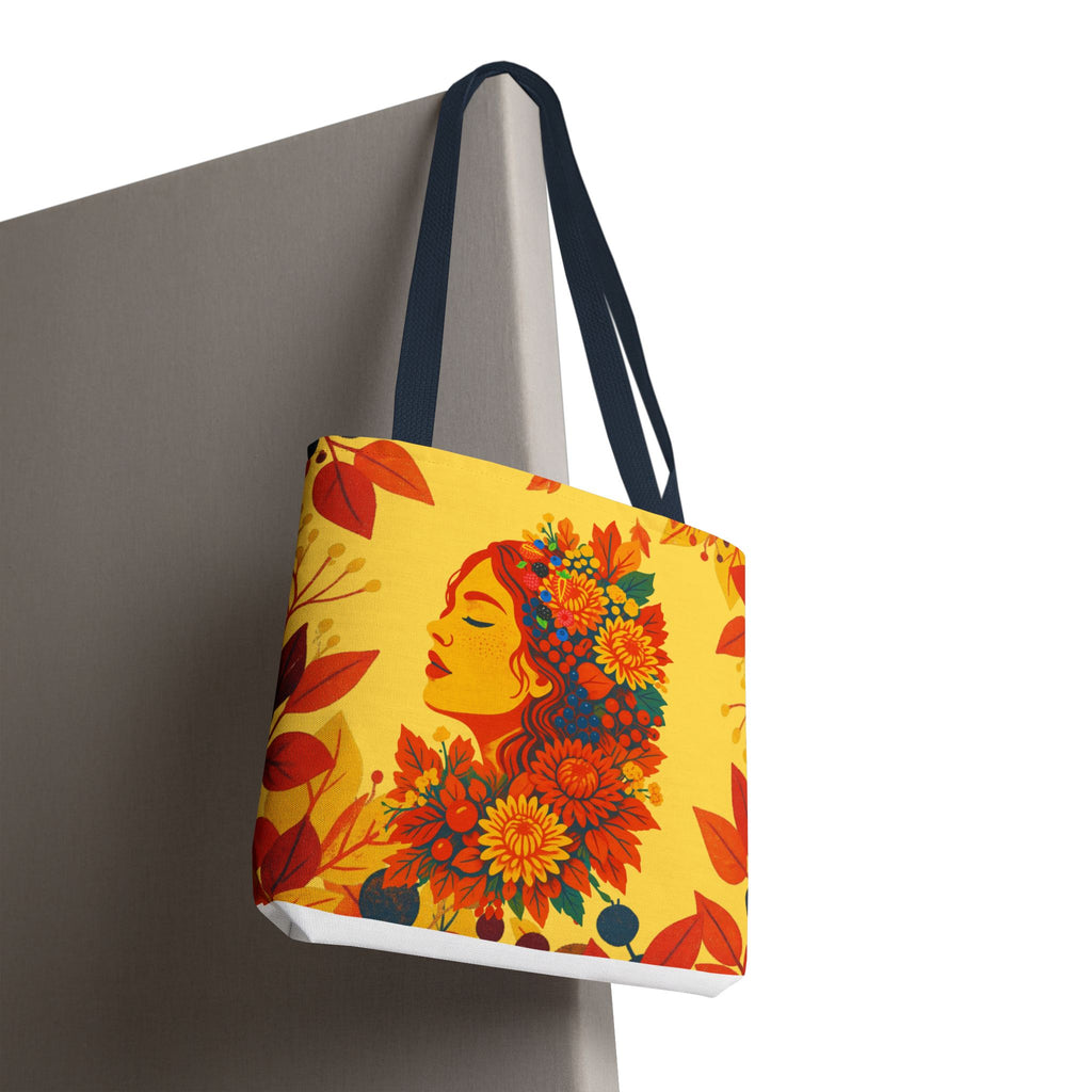 Tote bag with floral face design and woman's face on a yellow background