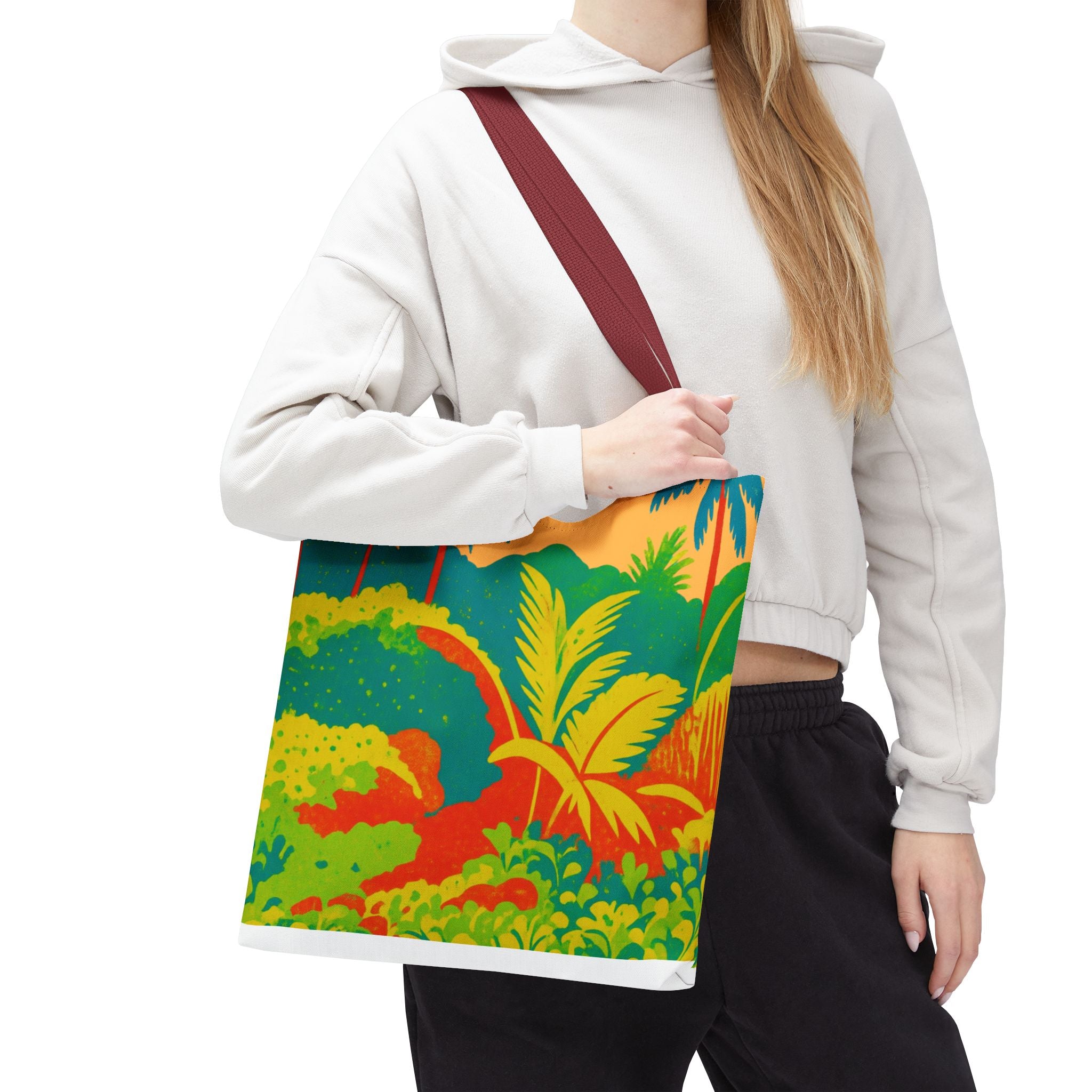 Person holding a colorful tote bag with a tropical design inspired by St Joseph in Barbados on a white background