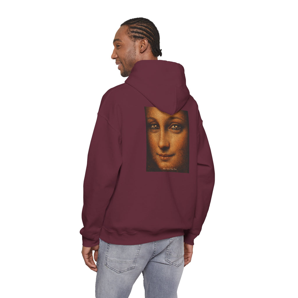 Man wearing maroon hoodie showing back view showing a reimagined graphic of Da Vinci's Mona Lisa on a white background 