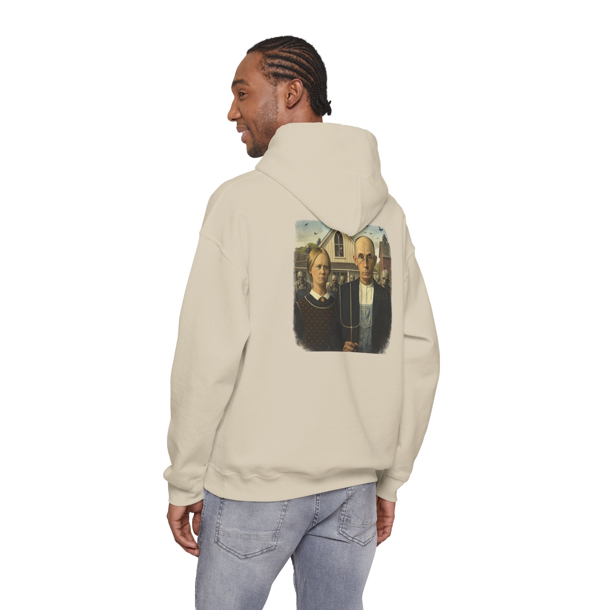 Man wearing Beige hoodie with a graphic of a  reimagined American Gothic by Grant Wood on the back, displayed on a white background.