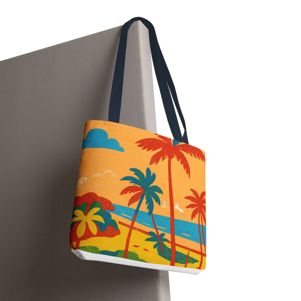 Tote bag with tropical design inspired by St Philip in Barbados featuring palm trees and a sunset on a gray surface.
