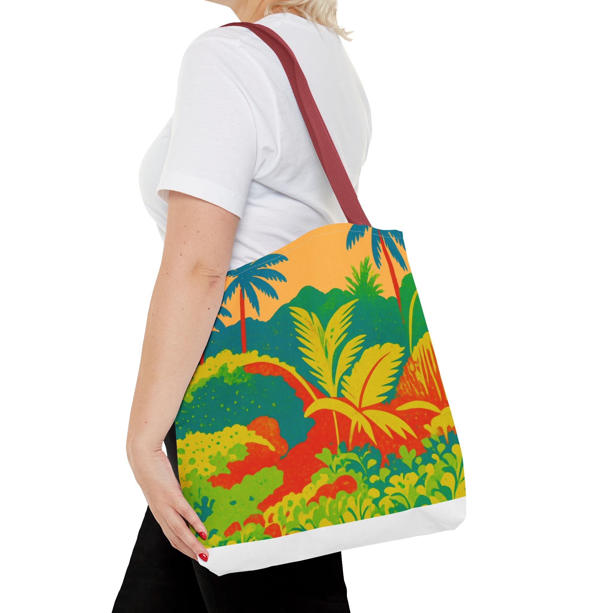 Person holding a colorful tote bag with a tropical design inspired by St Joseph in Barbados on a white background