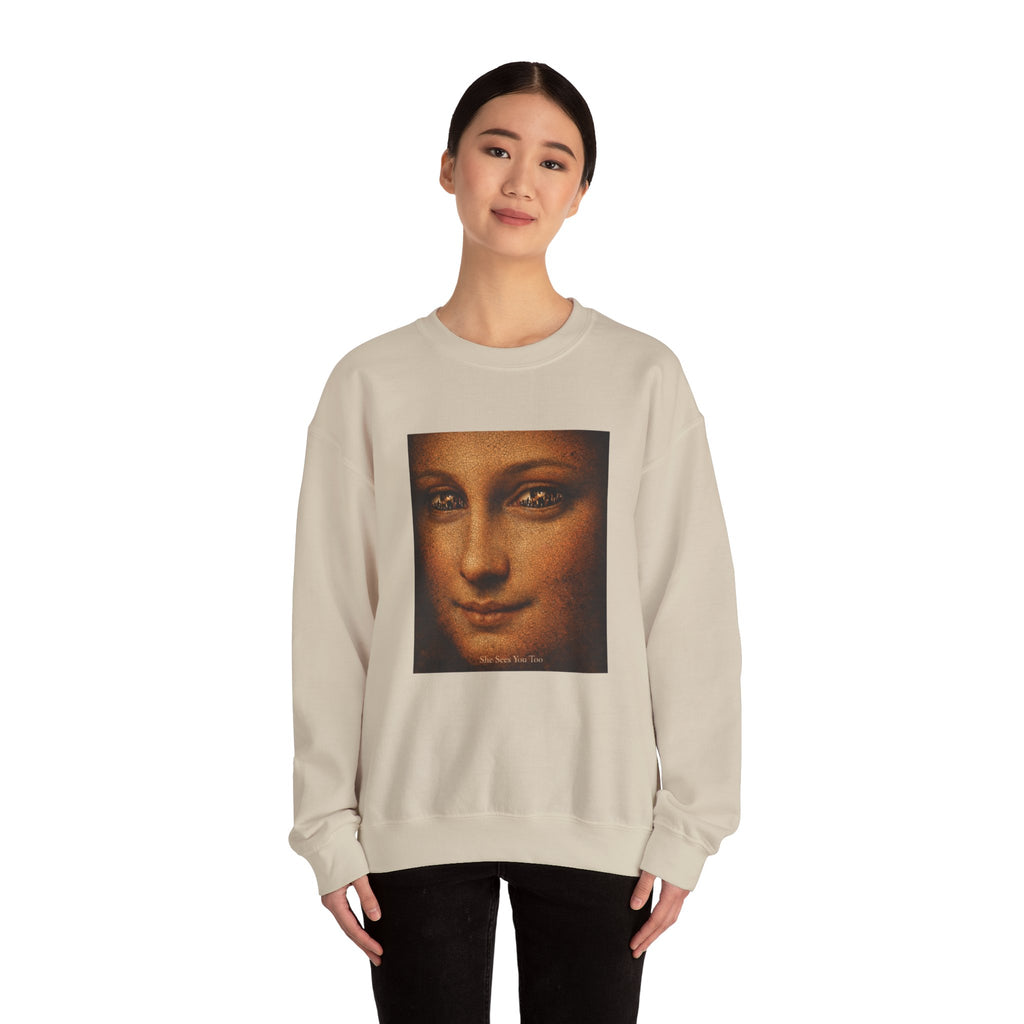 woman wearing a sand sweatshirt showing a reimagined image of Da Vinci's Mona Lisa on a white background