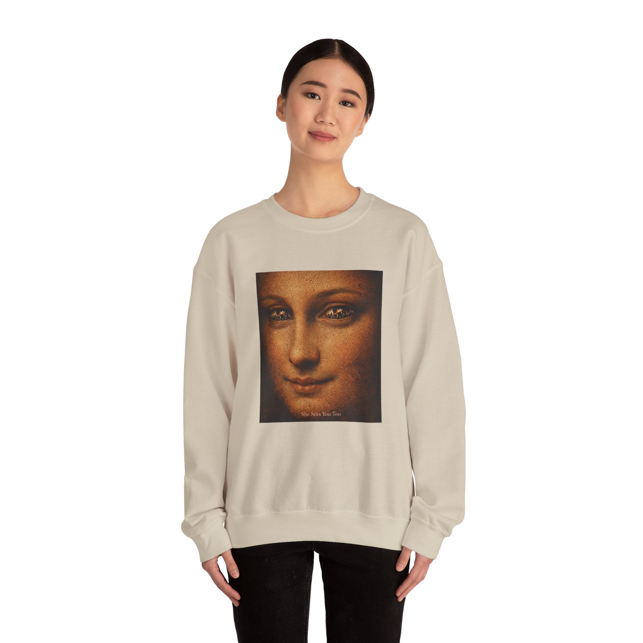 woman wearing a sand sweatshirt showing a reimagined image of Da Vinci's Mona Lisa on a white background
